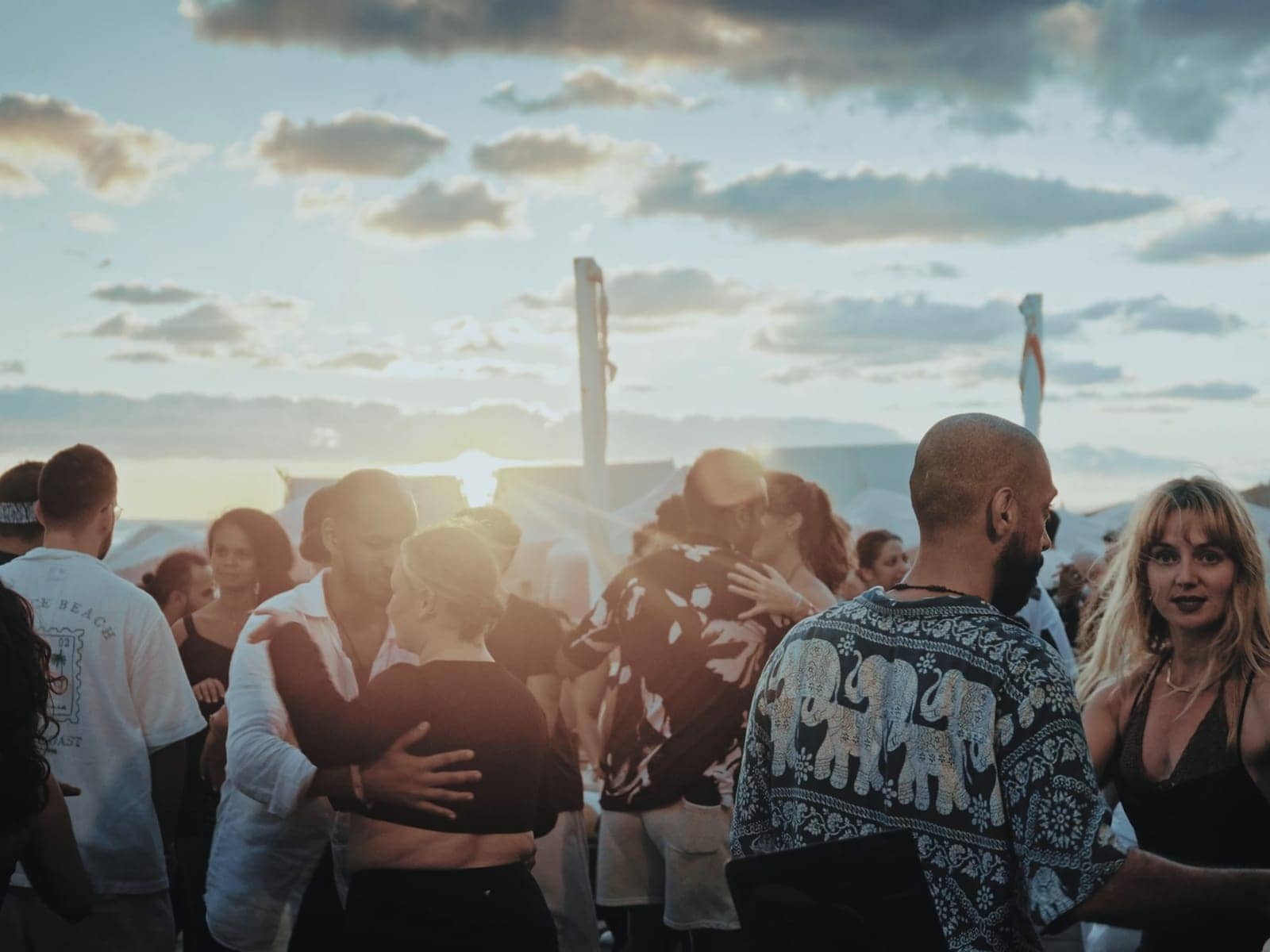 Dancers on the beach as the sun sets